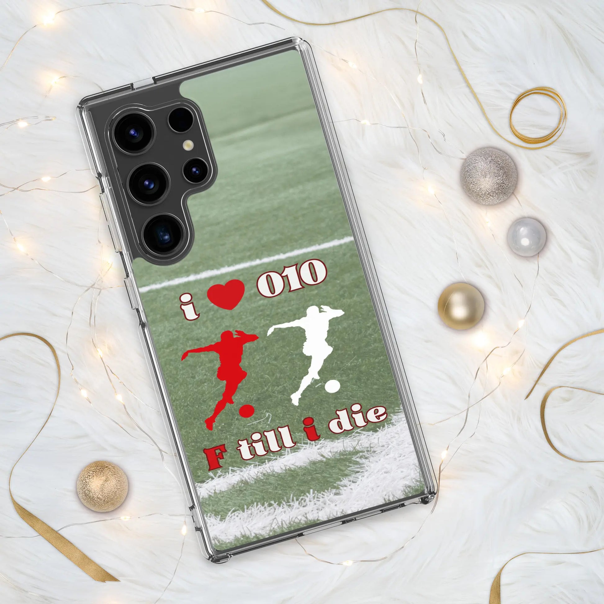 Feyenoord telefoonhoesje voor Samsung met I Love 010 en F Till I Die design, geplaatst op een witte achtergrond met kerstdecoraties