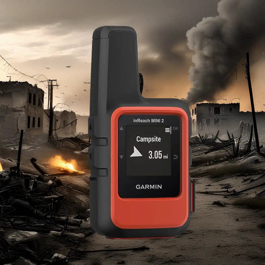 Garmin inReach Mini 2 voor satellietcommunicatie in oorlog en noodsituaties, met verwoeste stad op achtergrond